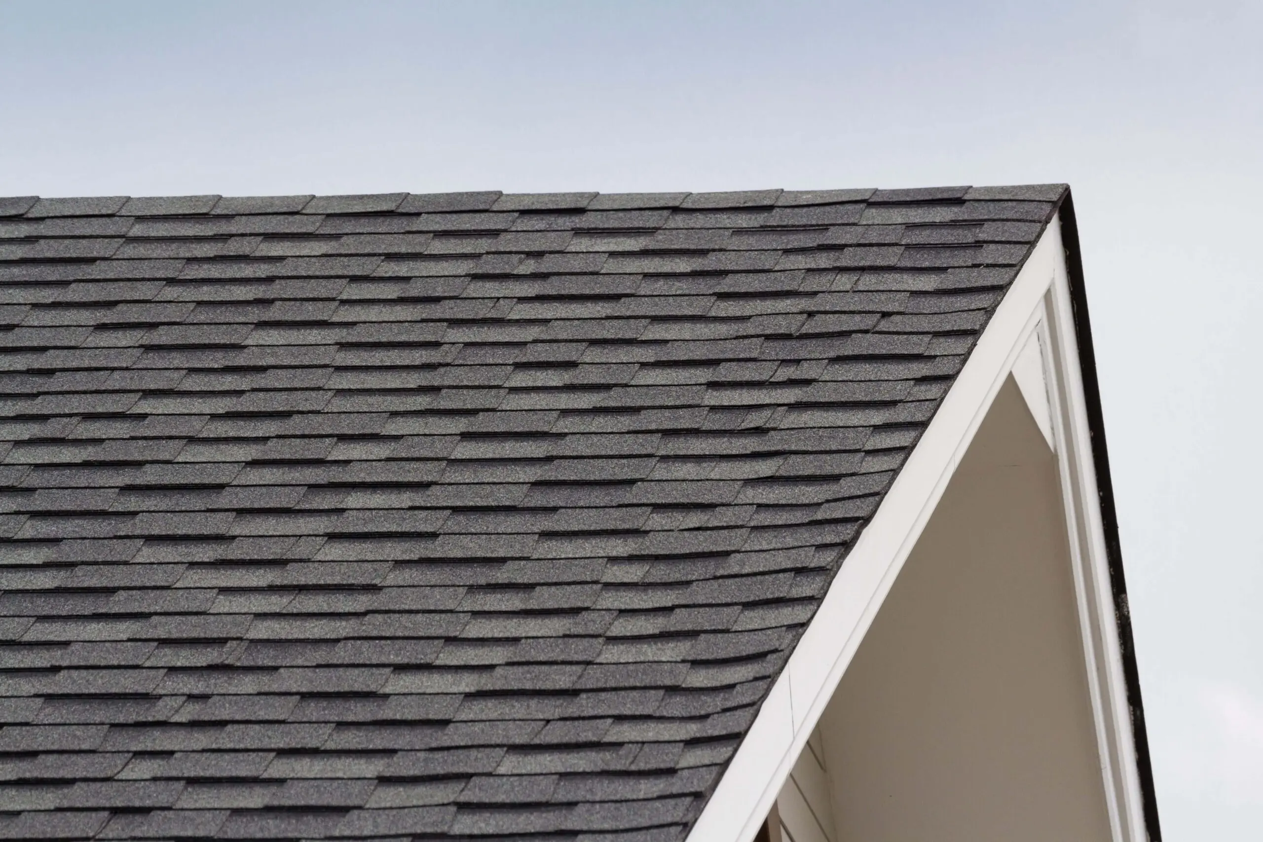 A photo of a gray roof with white trim