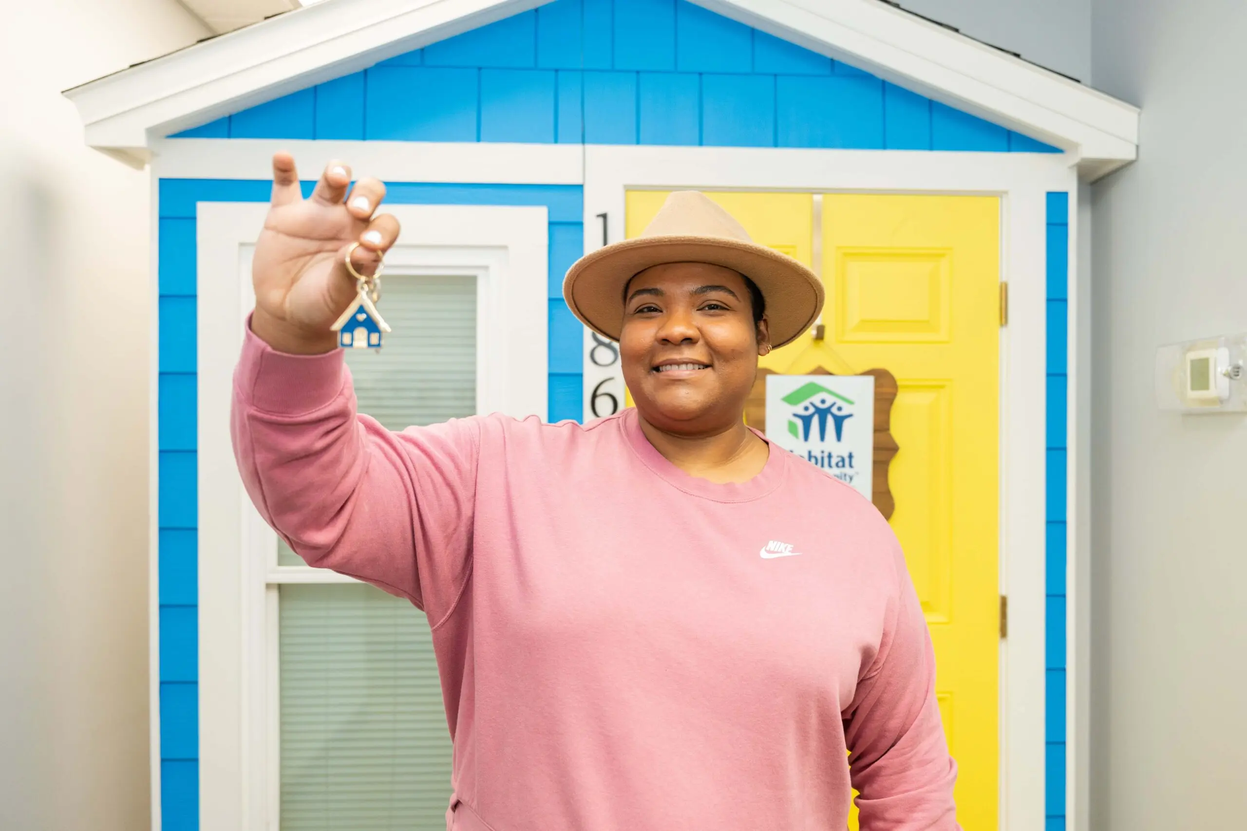 Close-up of golden hammers on top of black Bibles on blue tablecloth